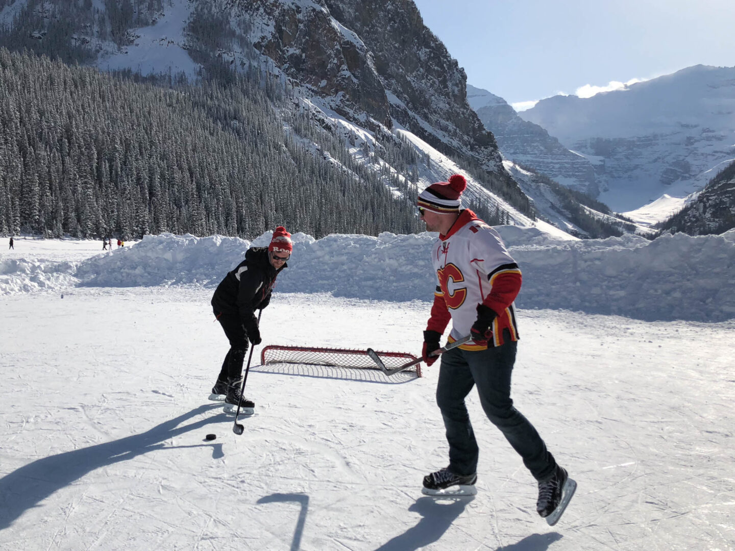 Lake Louise friends playing ice hockey