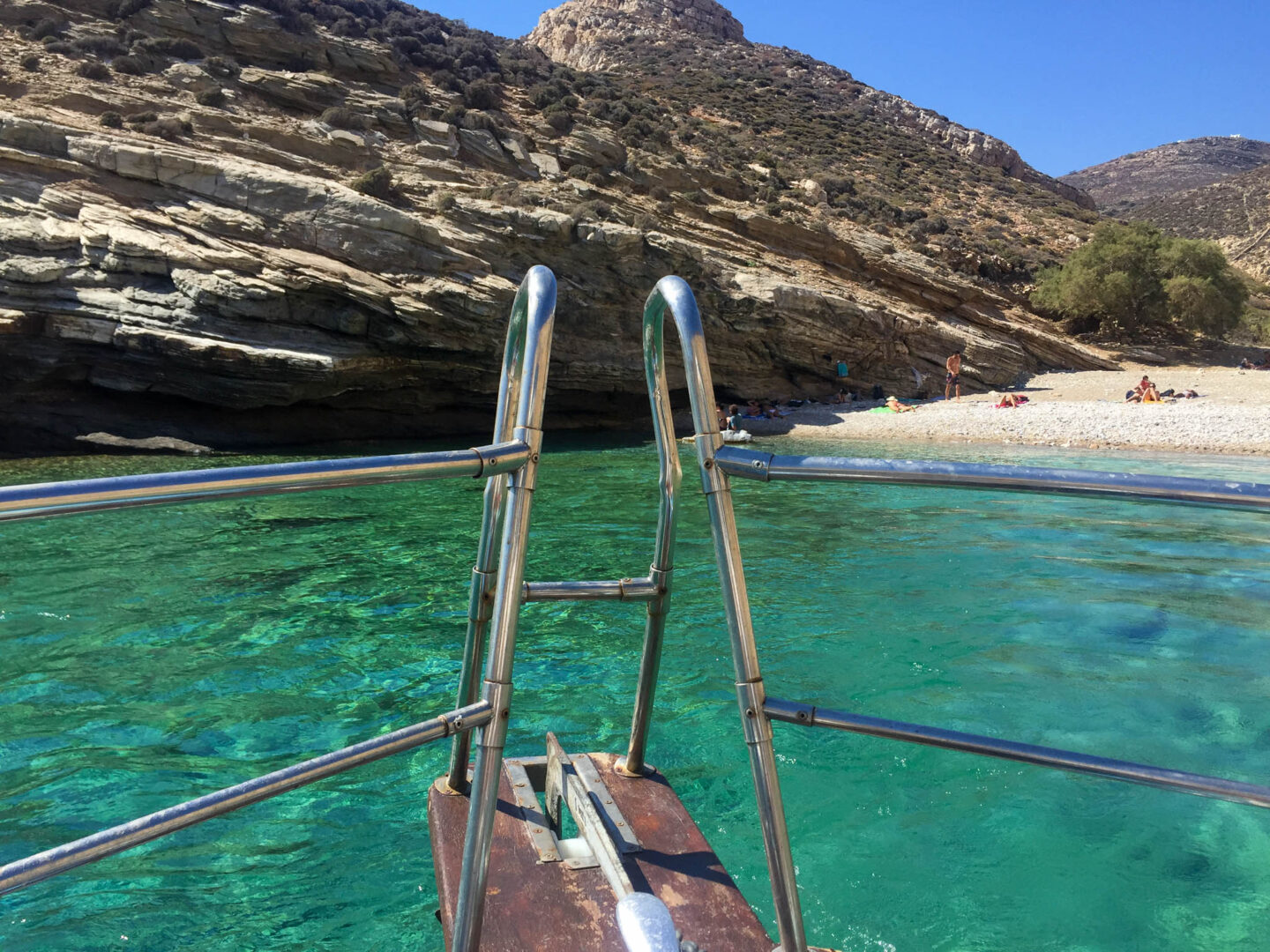 Folegandros Livadaki boat emerald water