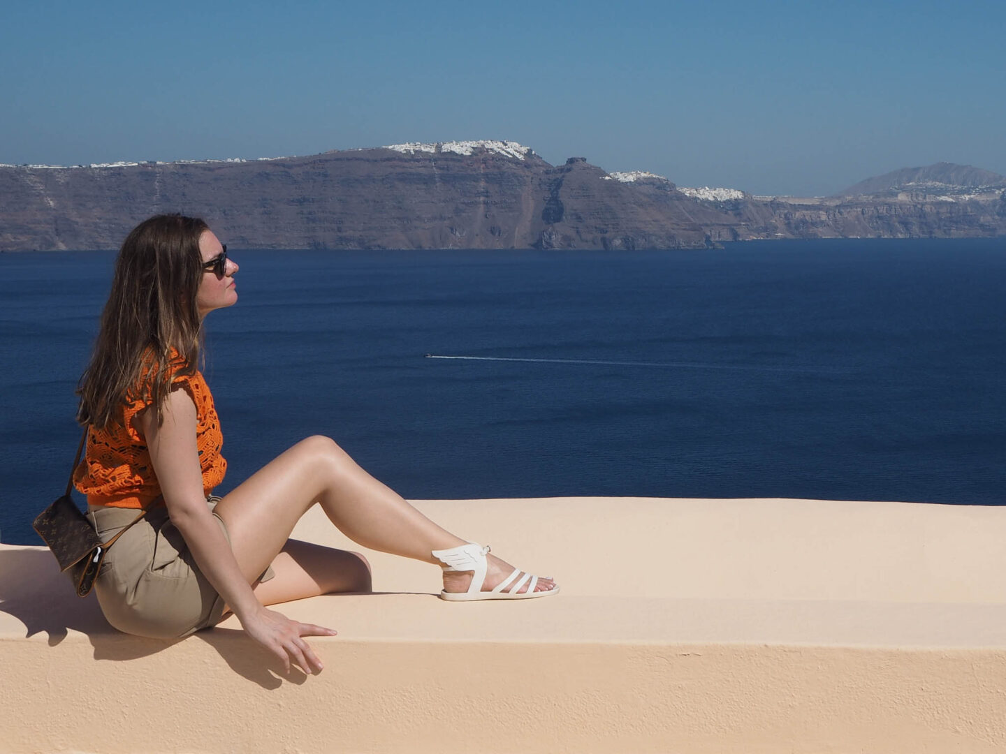 Santorini pink wall caldera view